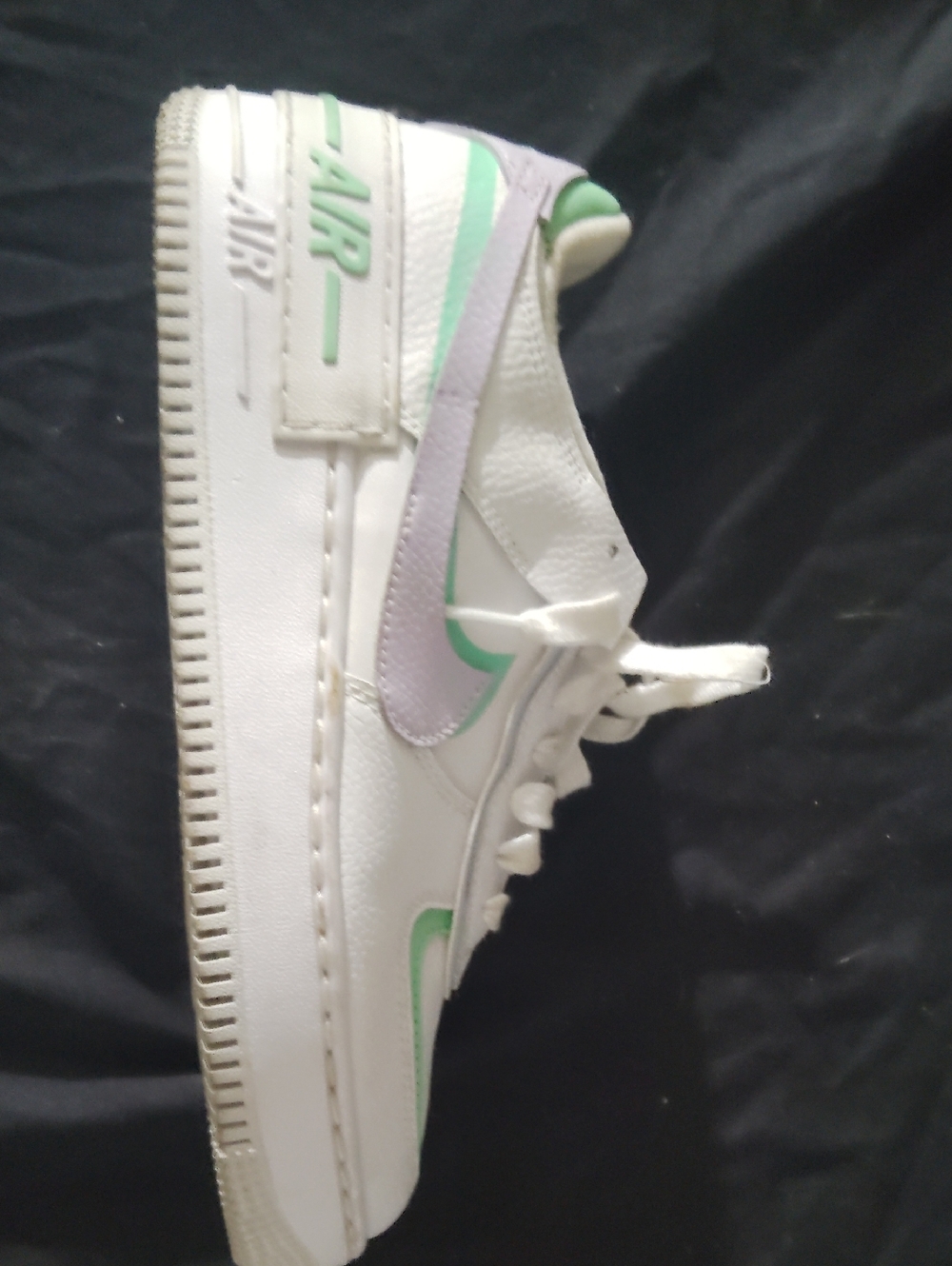 Nike White Low-Top Sneaker with Mint and Lavender Swoosh
